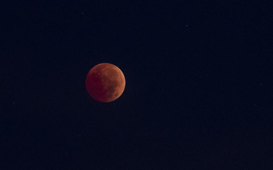 A blood moon is seen from Germantown, Md., early Tuesday, Nov. 8, 2022, during a total lunar eclipse.