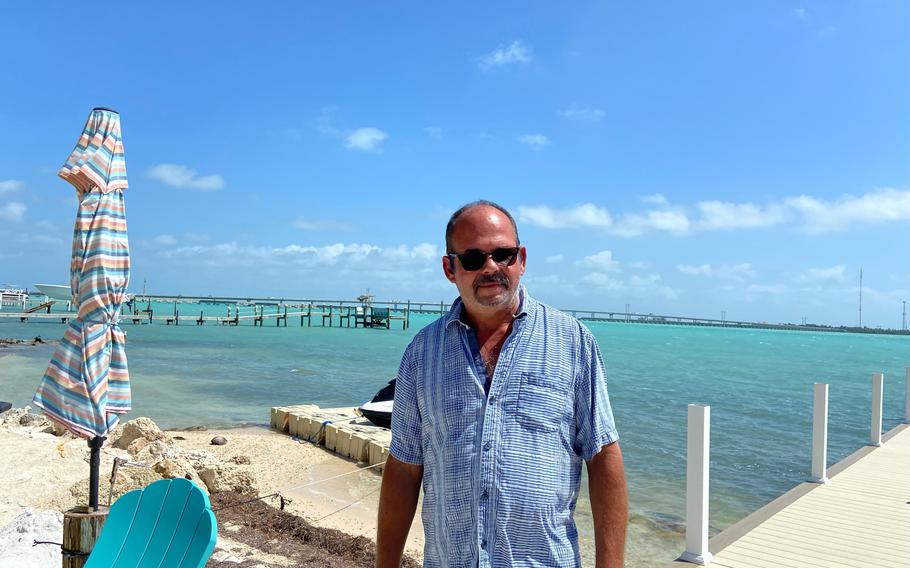 Francisco Nunez stands in his backyard in Summerland Key. He came to the United States from Cuba in 1980 via the Mariel boatlift. 