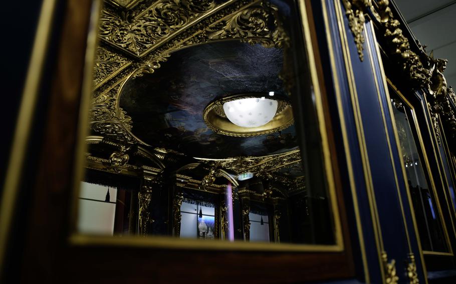 The intricate ceiling painting inside King Ludwig II's rail car at the Deutsche Bahn Museum in Nuremberg, Germany, seen on Dec. 20, 2023. The opulent artwork reflects the luxurious style of the "Fairytale King."