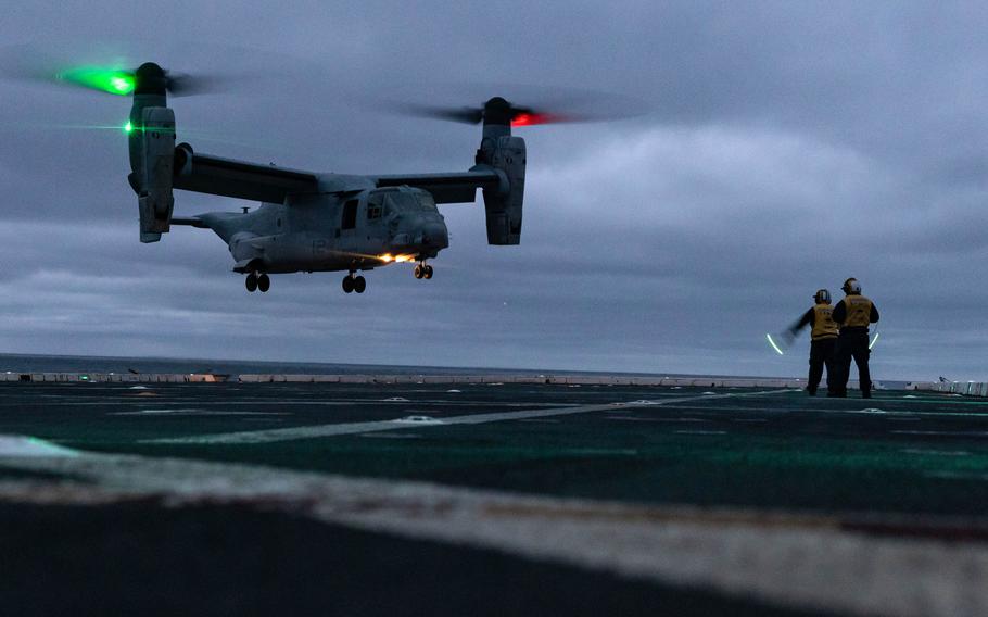 A sailor guides a Marine Corps MV-22 aboard the amphibious transport dock ship USS Mesa Verde on Feb. 1, 2023. The Marines, Navy and Air Force have grounded an undisclosed number of Ospreys pending replacement of a part.