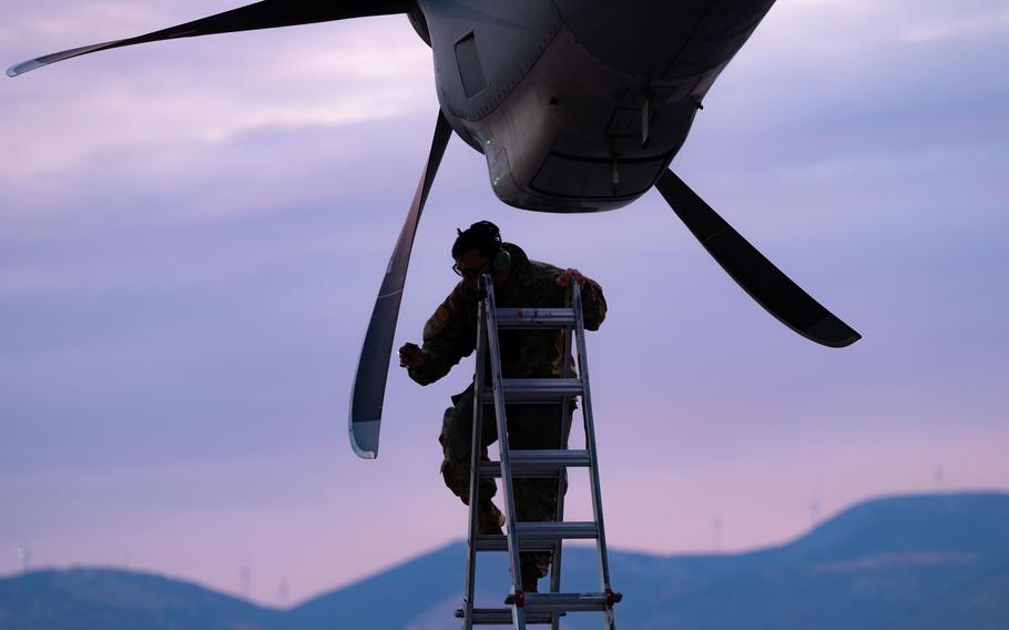 An airman from the 86th Maintenance Squadron inspects the propeller of a C-130J Super Hercules aircraft before takeoff at Elefsina Air Base, Greece, May 2, 2023, as part of the Stolen Cerberus X joint training exercise. The Air Force is planning to position various aircraft at the base near Athens, Greek media reported this week. 