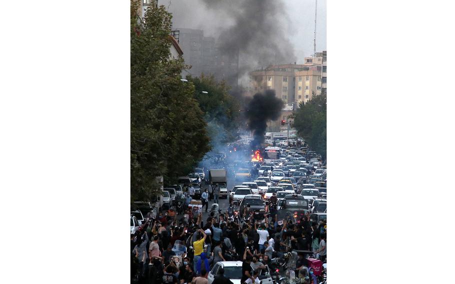A picture obtained by AFP outside Iran on Sept. 21, 2022, shows Iranian demonstrators taking to the streets of the capital Tehran during a protest for Mahsa Amini, days after she died in police custody. 