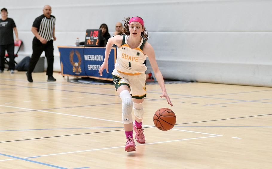 SHAPE guard Jessica Moon dribbles in for a layup during pool-play action of the DODEA European basketball championships against Lakenheath on Feb.14, 2024, at the Wiesbaden Sports and Fitness Center on Clay Kaserne in Wiesbaden, Germany.