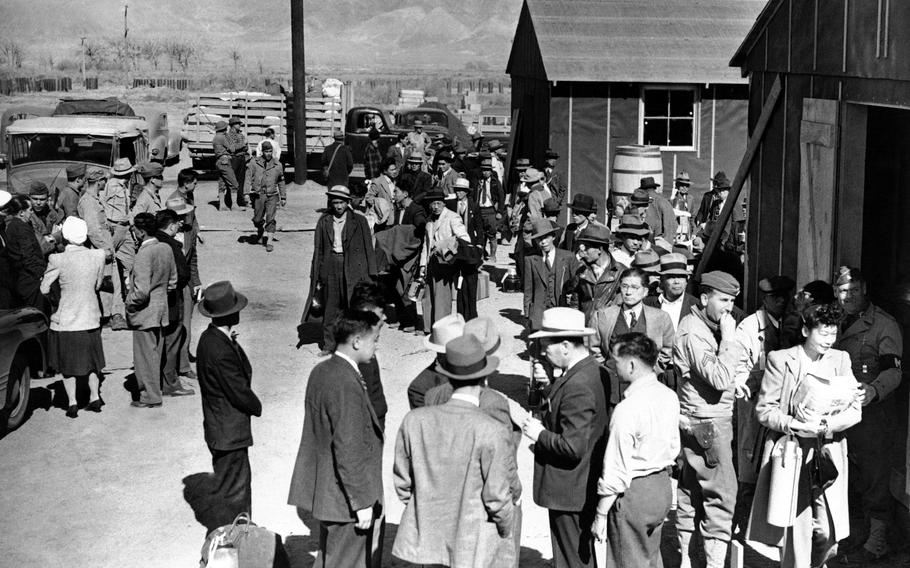 This March 23, 1942, photo shows the first arrivals at the Japanese evacuee community established in Owens Valley in Manzanar, Calif. Roughly 120,000 Japanese immigrants and Japanese-Americans were sent to camps that dotted the West because the government claimed they might plot against the U.S.