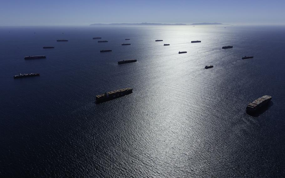 Container ships are moored off Los Angeles and Long Beach, Calif., ports on Oct. 9, 2021. 