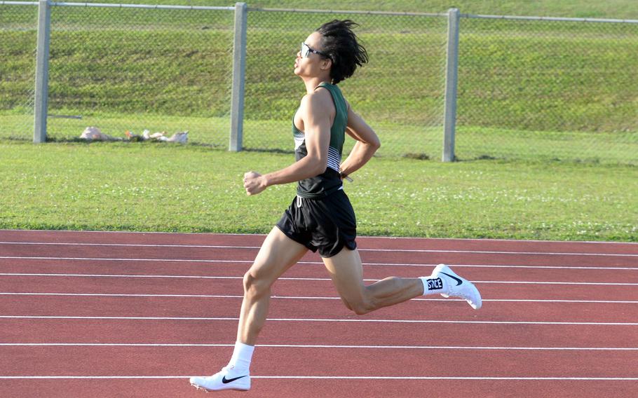 Kubasaki's Joachim Killian rounds the curve of the 800 during Wednesday's Day 1 of the two-day Okinawa track and field meet. Killian won the 800 and the 1,600 on Thursday.