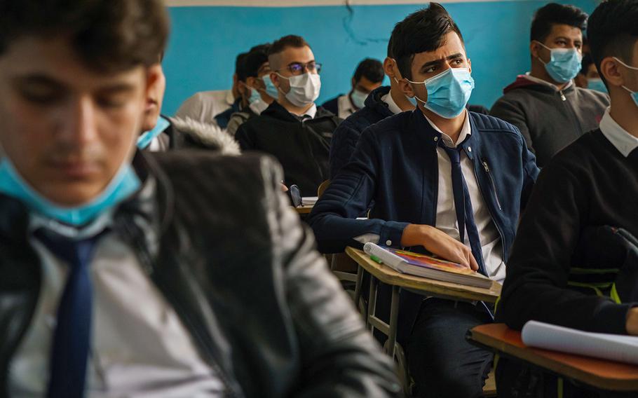 Students sit in a math class at the Sharqiyah Preparatory School in Karradeh neighborhood of Baghdad, Iraq, Thursday, Nov. 25, 2021. 