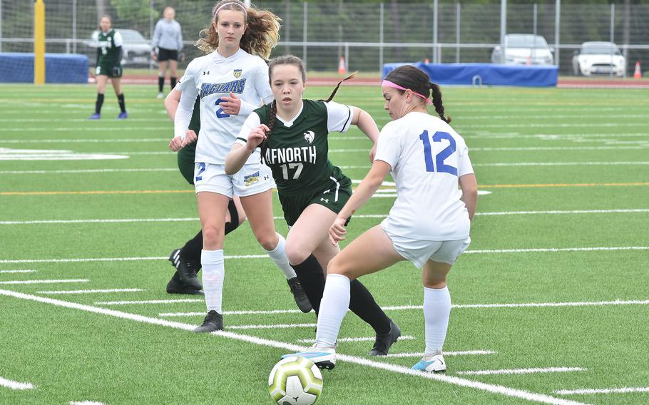 AFNORTH's Isabella Guest races after the ball after she pushed it by Sigonella's Megan Shoemaker on Tuesday, May 16, 2023, at the Division III girls championships at Ramstein Air Base, Germany.