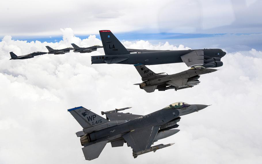 South Korean F-15K Slam Eagles fly alongside U.S. F-16 Fighting Falcons and a B-52H Stratofortress bomber during an air drill near South Korea, July 13, 2023.