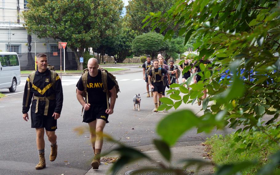 A ruck walk by about 25 soldiers, spouses and some energetic canines marked an opportunity to remember and reflect during Suicide Prevention and Awareness Month at Camp Zama, Japan, Thursday, Sept. 22, 2022.