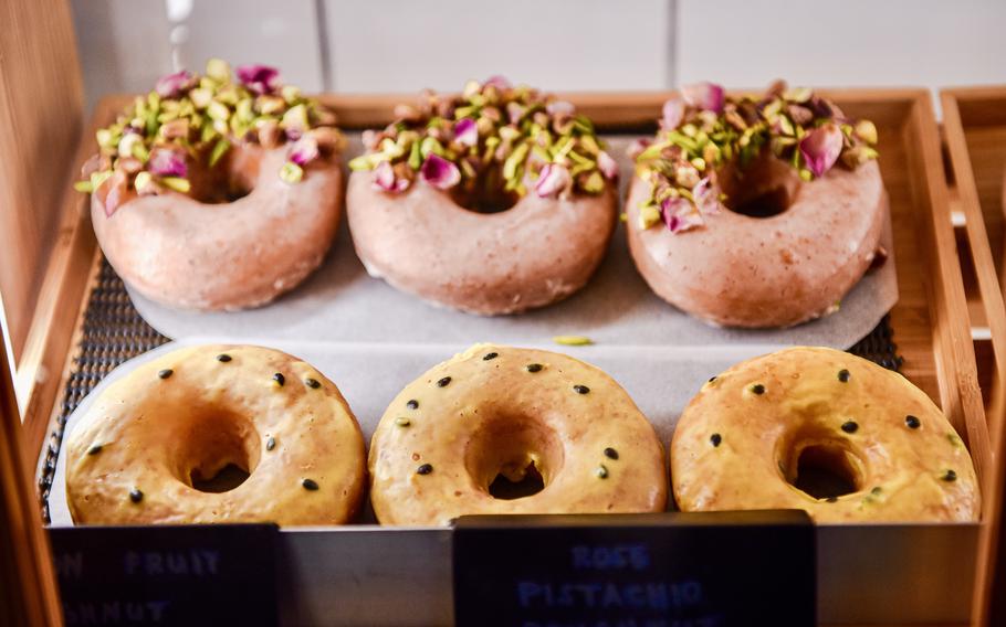 The bakery at Petiole Cafe in Bahrain boasts many options, including these brioche-raised doughnuts, which have rose pistachio and passion fruit flavoring.