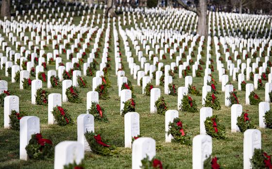 32nd Wreaths Across America Day in Section 33 of Arlington National Cemetery, Arlington, Va., Dec. 16, 2023. On this day, more than 30,000 volunteers placed approximately 260,000 wreaths at every gravesite and niche column at Arlington National Cemetery. (U.S. Army photo by Elizabeth Fraser / Arlington National Cemetery / released)