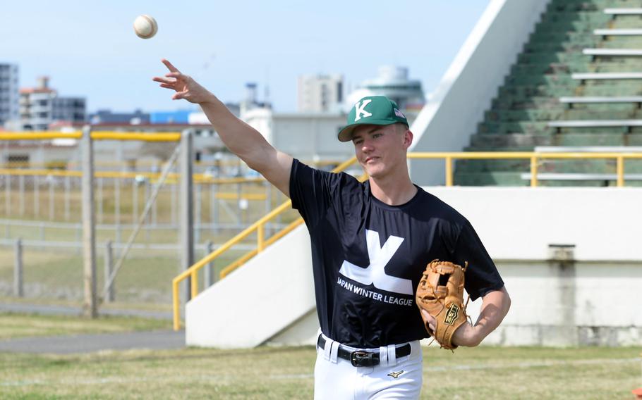 Asher Romnek tosses the ball.