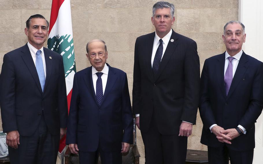 In this photo released by Lebanon’s official government photographer Dalati Nohra, Lebanese President Michel Aoun, second left, poses for a picture with U.S. congressmen Rep. Darrell Issa, a California Republican, left, Republican Rep. Darin LaHood of Illinois, center, and Edward Gabriel, head of the Washington-based American Task Force for Lebanon, right, in Beirut, Lebanon, Saturday, Nov. 20, 2021. A group of U.S. congressmen held meetings Saturday with Lebanon’s top leaders during a fact-finding mission to the Middle East nation roiled by an unprecedented economic crisis.