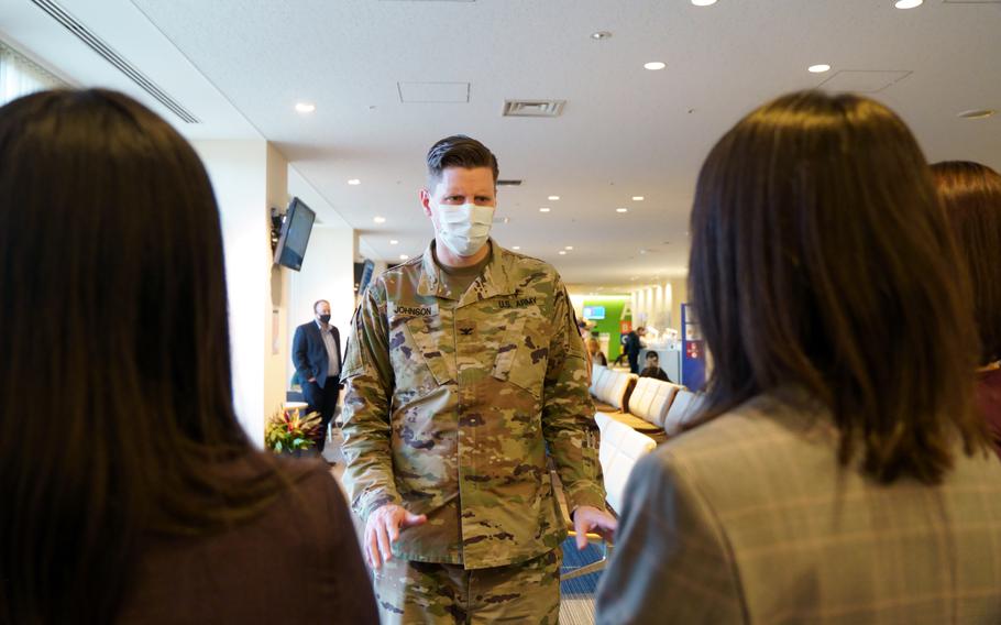 Intepreters staffing a U.S. civilian help desk at Zama General Hospital get a visit from Col. Jeremy Johnson, medical department commander for U.S. Army Japan, Feb. 7, 2024.