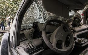 A destroyed car near the site of a Russian missile strike Tuesday on a residential building in Kyiv. MUST CREDIT: Oksana Parafeniuk/For The Washington Post