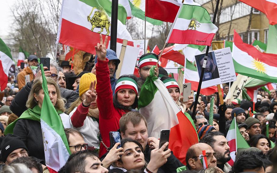People gather for a protest to support the Iranian resistance movement, Monday, Feb. 20, 2023 in Brussels.
