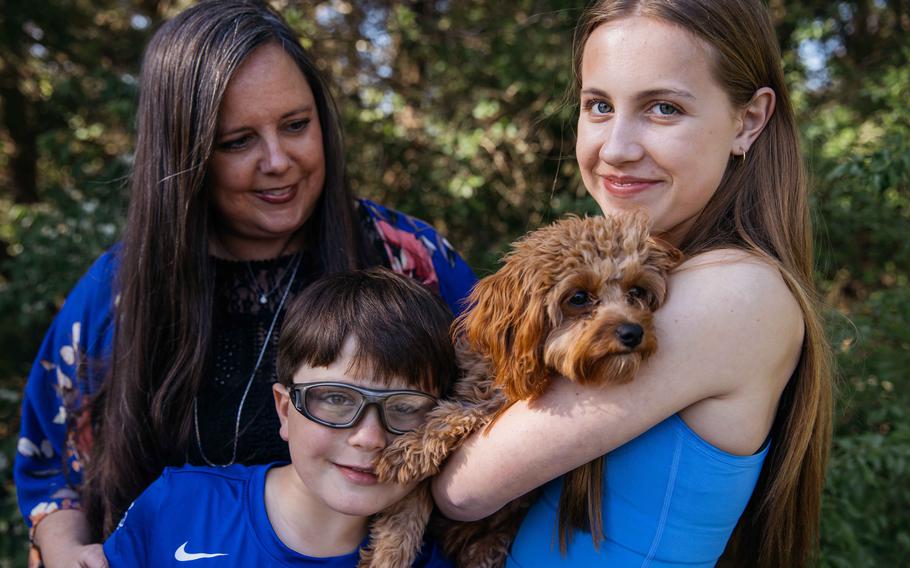 Adriana, Jack and Annalise Stacey with their dog, Rosemary. 
