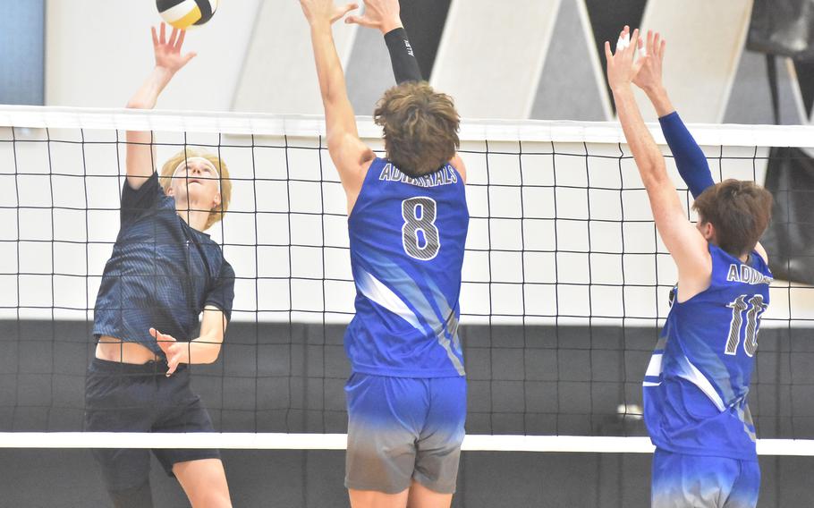 Black Forest Academy’s Timothy Sivonen gets set to tip the ball past the Rota block of Tyler DeMeritt, left, and Jackson Warkentien in the Falcons’ straight-set victory over the Admirals in the DODEA-Europe boys volleyball championships Saturday, Oct. 28, 2023, in Vicenza, Italy.