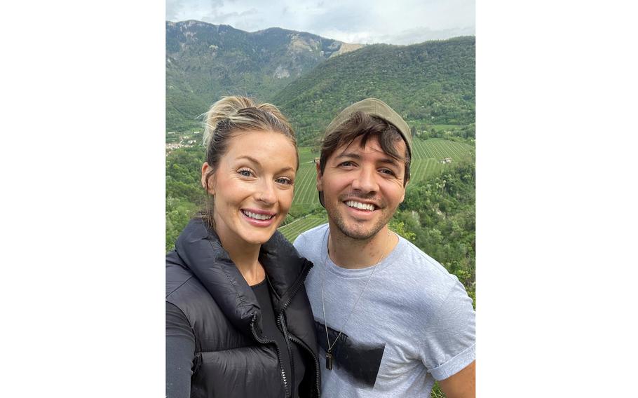 Tine Kirby and Kiefer Jones pose while hiking on May 8, 2022, near their home by Aviano Air Base, Italy, where Jones is a contractor. The couple has started taking their first outings since Jones suffered serious injuries in a snowboarding accident in Austria in January.