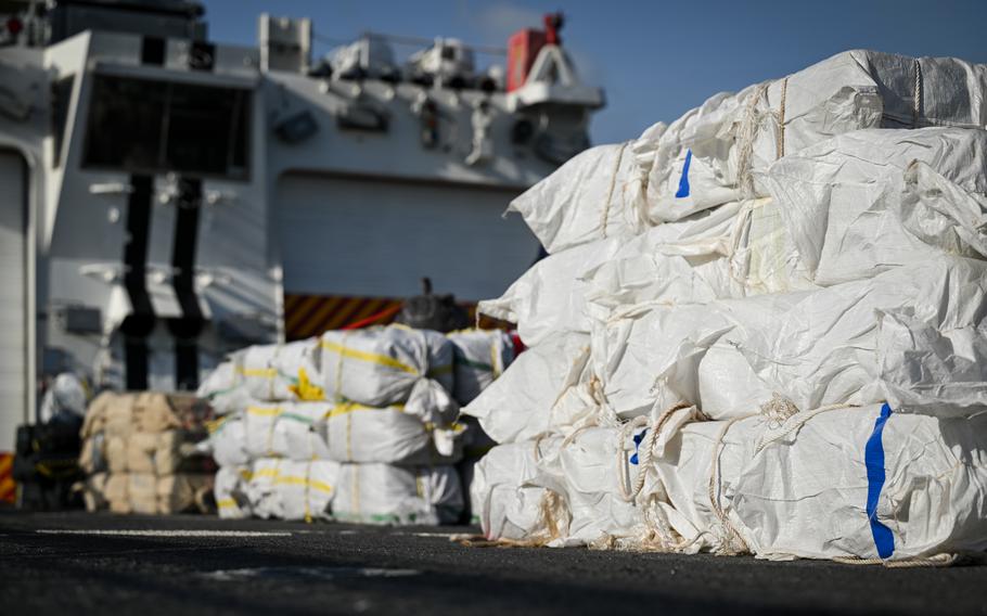 Bales of illegal drugs are offloaded
