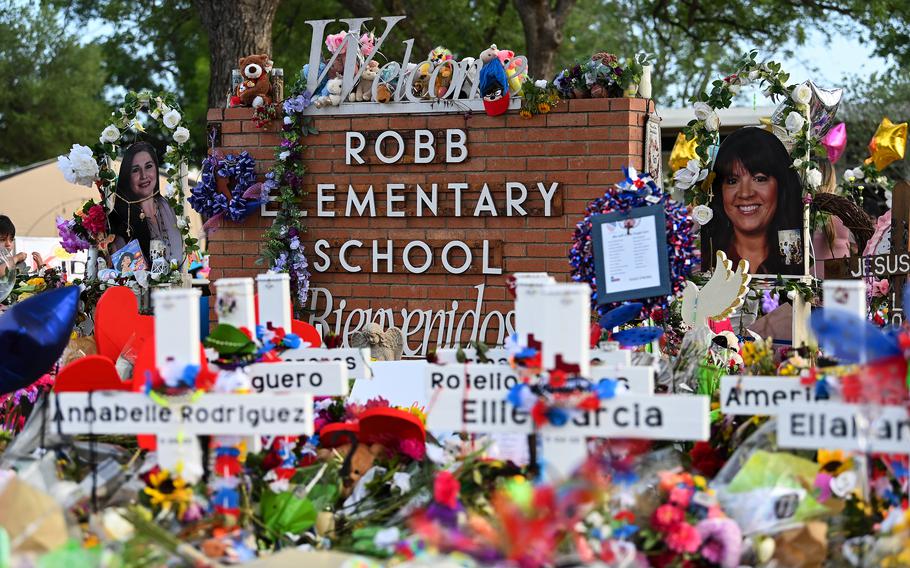 Flowers, balloons, toys and other items are seen May 31 at a memorial for the students and teachers killed in the Robb Elementary School shooting in Uvalde, Texas.