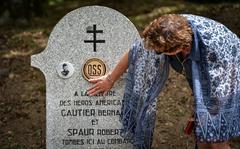 Jamie Jamison gently touches a commemorative stele that marks the area where her great uncle died in 1944 during a visit to the site May 28, 2022. Jamison is the great niece of Bernard Gautier, one of the two Office of Strategic Services men killed during a firefight with German troops near the village of Le Rialet.