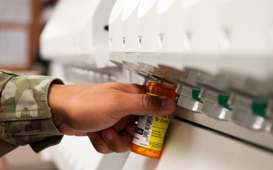 A pill bottle is filled at the 5th Medical Group building on Minot Air Force Base, N.D.
