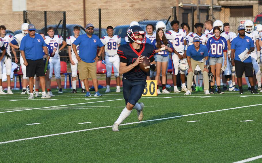 Lakenheath Lancers’ quarterback Nico Marchini takes a snap and scans the right side of the field for an opening in the Ramstein Royals’ defense. 