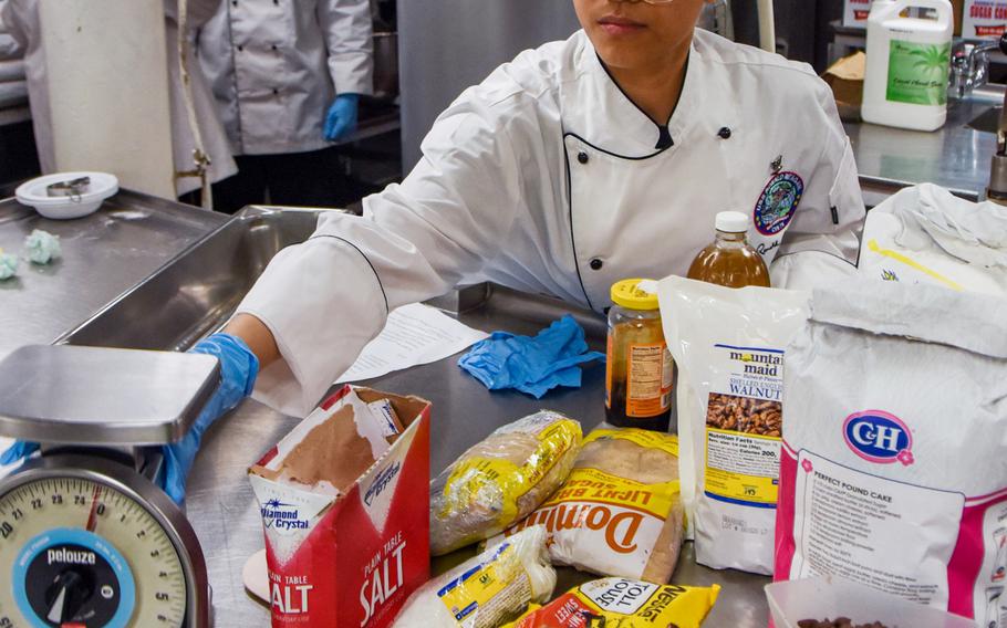 Petty Officer 3rd Class Anna Jenica Moralez prepares ingredients for Nancy Reagan’s favorite chocolate chip cookies aboard the USS Ronald Reagan in the Arabian Sea, July 5, 2021. The treats were served July 6, on what would have been the former first lady’s 100th birthday.