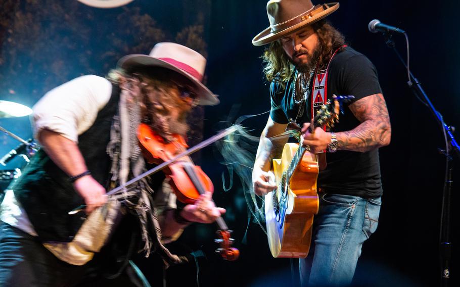 The country music duo War Hippies — Marine veteran and guitarist Scooter Brown and Army veteran and violinist Donnie Reis — perform March 9, 2023, at MadLife Stage & Studios in Woodstock, Ga., just north of Atlanta.