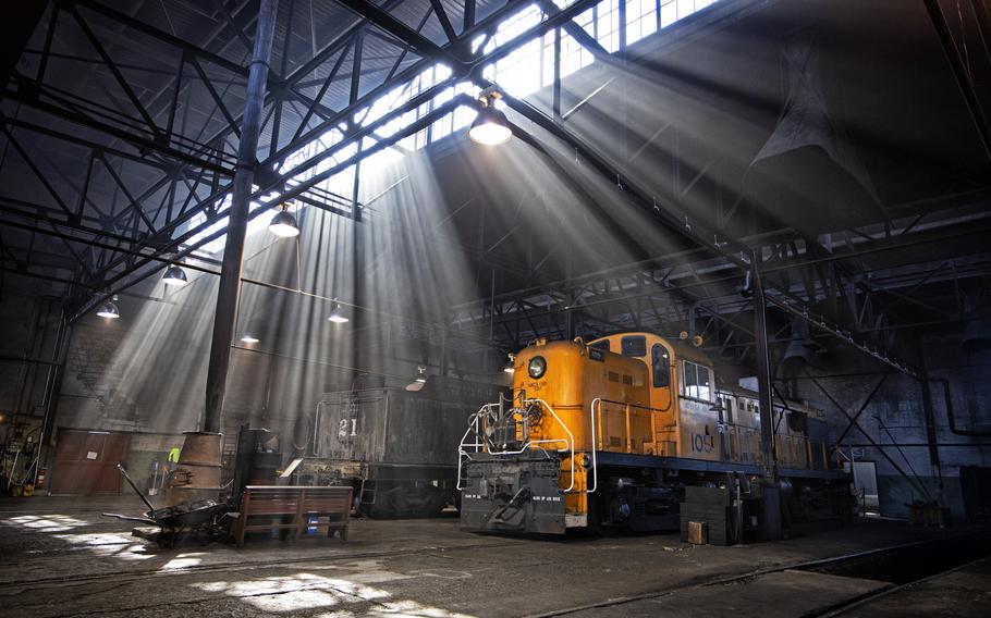 Light streams through the smoke-filled East Ely, Nev., railroad shop.