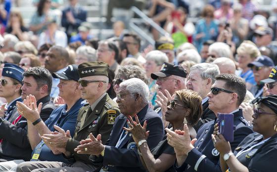 Applause rises from a crowd attending on Thursday, May, 11, 2023, the opening ceremony of a three-day event in Washington, D.C., to honor Vietnam War veterans. In the center of the first row is retired Army Sgt. 1st Class Melvin Morris, who was awarded the Medal of Honor for his extraordinary heroism during a 1969 battle in Vietnam.