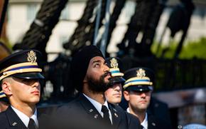 Kanwar Singh prays before his commissioning ceremony aboard the USS Constitution in August 2018. Singh, a practicing Sikh and native of New Dehli, enlisted in the U.S. Army to attend officer candidate school in Massachusetts in 2015, but had to file for a religious accommodation to continue serving while practicing his faith.