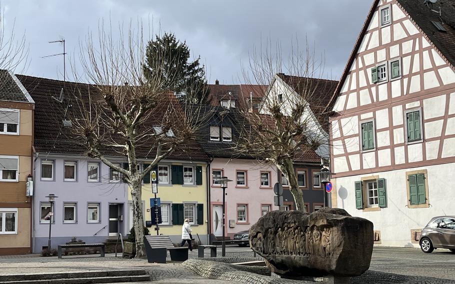 A town square in Otterberg, Germany with a large half-timbered house.