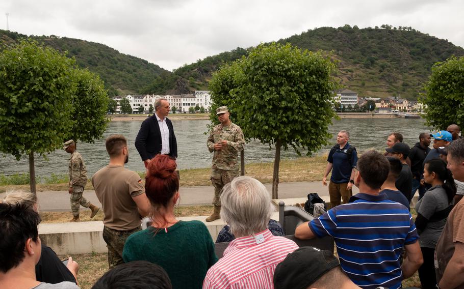 Army Lt. Col. Raul Sandoval, adjutant general of the 21st Theater Sustainment Command, presents a commanders coin to Mayor Falko Honisch of St. Goar, Germany, on July 11, 2022.