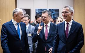 From left, NATO Deputy Secretary-General Mircea Geoana and Ukrainian Foreign Minister Dmytro Kuleba walk with NATO Secretary-General Jens Stoltenberg during talks in Brussels, Nov. 29, 2023. Stoltenberg said the alliance has given a series of recommendations to Ukraine on reforms needed as prerequisites for being accepted into the alliance.  