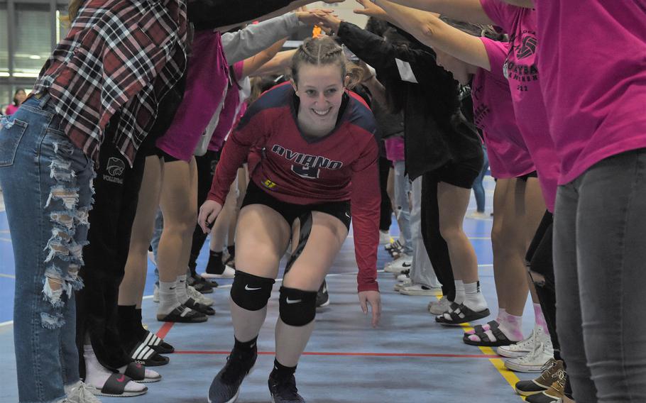 Aviano’s Mayci Salmon runs through the victory tunnel after the Saints defeated American Overseas School of Rome to win the DODEA-Europe girls’ Division II championships Saturday Oct. 29, 2022, at Ramstein High School. 