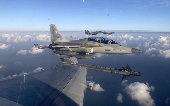 In this handout photo released by the Philippine Air Force, a Philippine Air Force FA-50PH jet fighter, joins the maritime patrol of the Philippines and the United States over Batanes and areas in the West Philippine Sea on Tuesday, Nov. 21, 2023. The United States and Philippines are conducting joint air and maritime patrols in the South China Sea, which come as the two countries step up cooperation in the face of growingly aggressive Chinese activity in the area. (Philippine Air Force via AP)