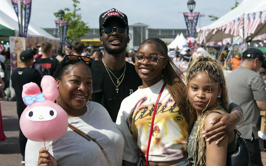 A group of festivalgoers pose together for a picture.