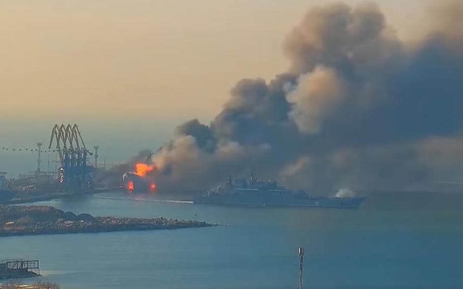 A screenshot from a video showing fires and columns of smoke rising from a ship docked at a port in Berdyansk, Ukraine, March 24th, 2022. Ukraine’s navy claimed Thursday it had destroyed a Russian landing ship at Russian-occupied Berdyansk.