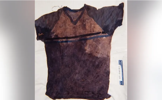 A shirt with blood and dirt is pictured