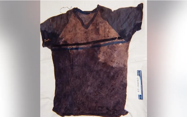 A shirt with blood and dirt is pictured