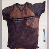 A shirt with blood and dirt is pictured