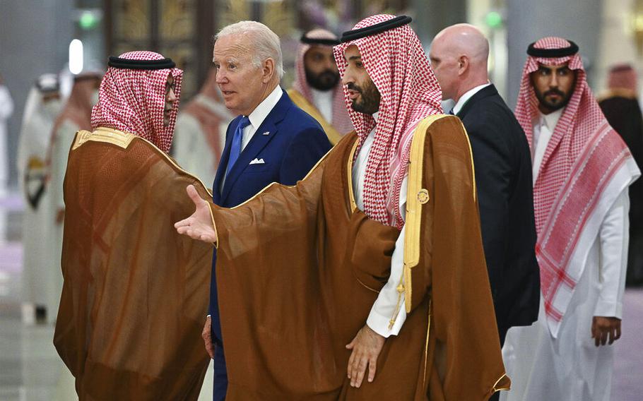 U.S. President Joe Biden and Saudi Crown Prince Mohammed bin Salman, center, arrive at a hotel in Saudi Arabia’s Red Sea coastal city of Jeddah on July 16, 2022. 