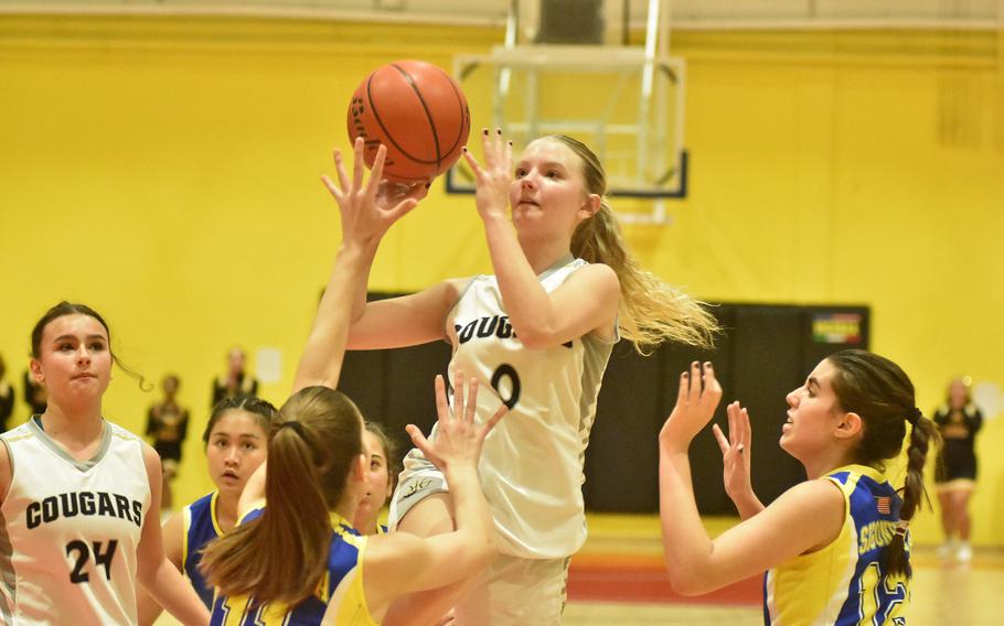 Vicenza’s Addison Kropp scores two of her game-high 17 points Friday, Jan. 6, 2023, in the Cougars’ 36-23 victory over Sigonella on Caserma Ederle.