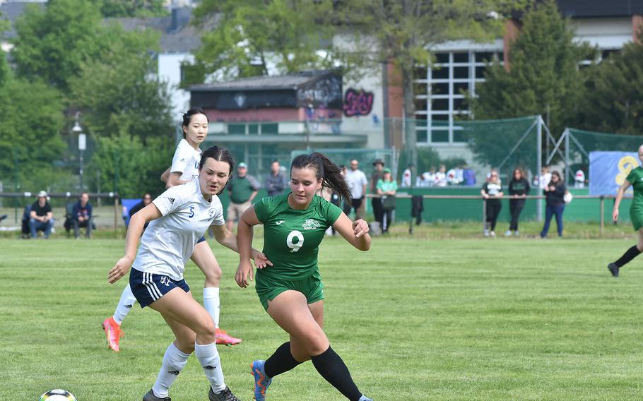 Black Forest Academy's Savannah Tweedy and Naples' Ally Garcia battled each other for the ball, then had to come back for it after they overran it on Monday, May 15, 2023, in the first round of the DODEA-Europe Division II soccer championships in Baumholder, Germany.