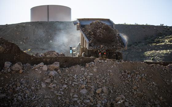 A dump truck unloads raw ore at the MP Materials Corp. Mountain Pass mine in Mountain Pass, California. MUST CREDIT: Joe Buglewicz/Bloomberg