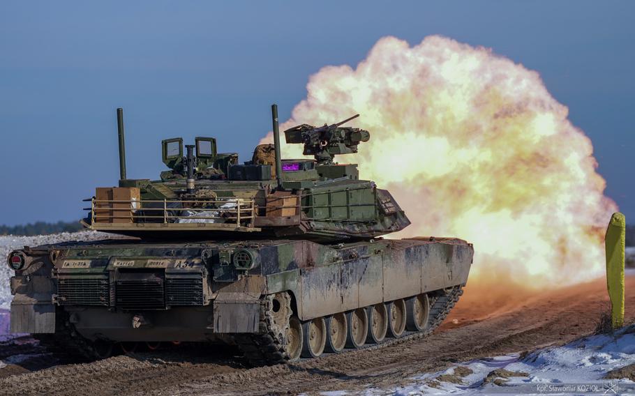 An Abrams tank fires during gunnery qualifications in Poland.