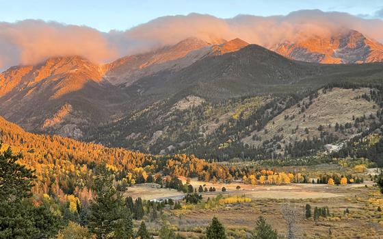 The sun rises over a valley in Rocky Mountain National Park. The park boasts incredible fall foliage, particularly on the Top of the Rockies, one of the highest continuous motorways in the United States. 